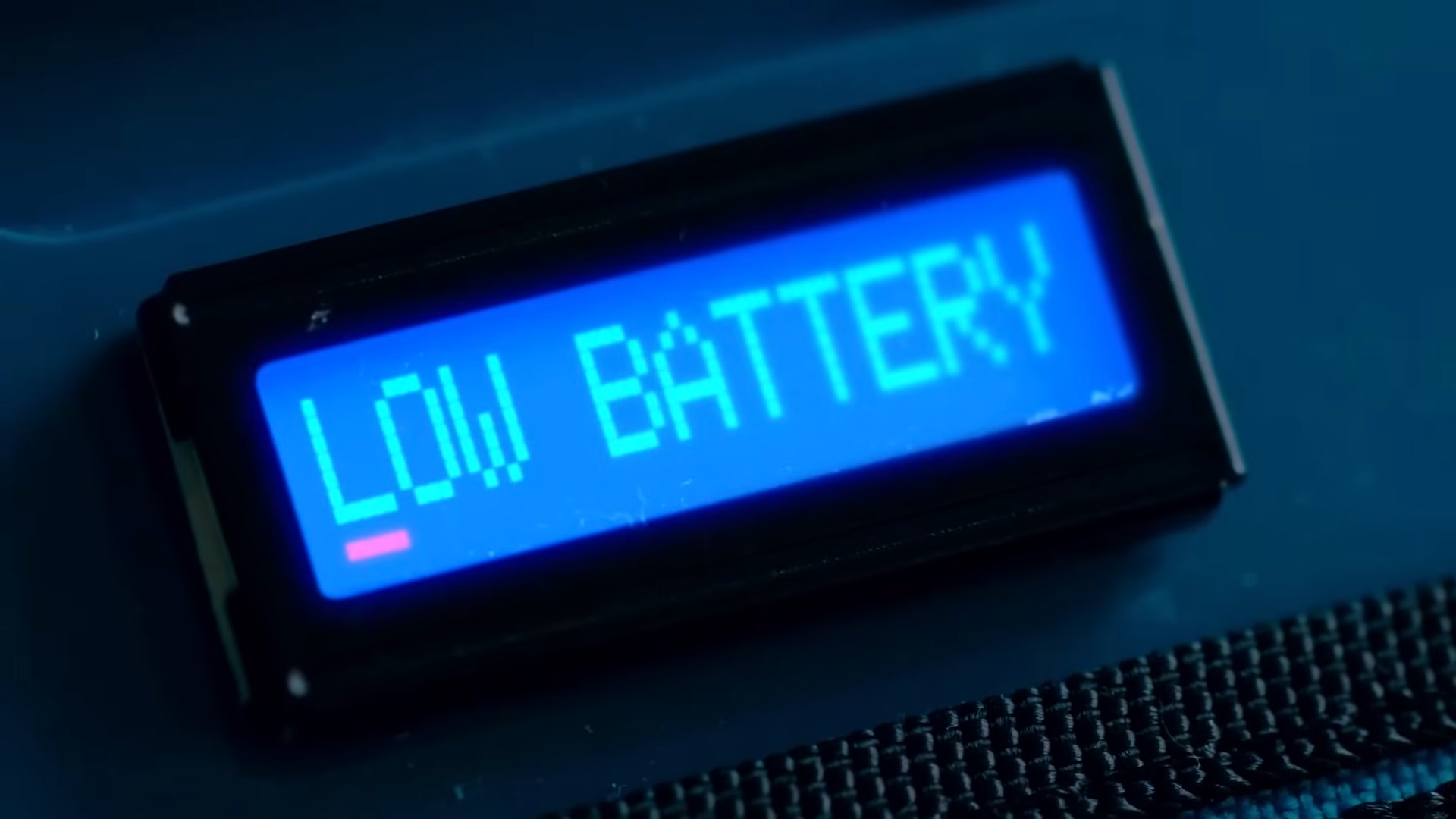 The backpack's screen displaying text reading 'Low battery.'